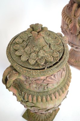 Lot 27 - A pair of terracotta covered planters on...