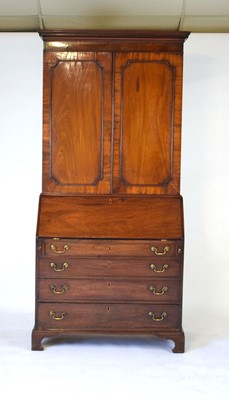 Lot 33 - A George III mahogany bookcase cabinet, the...