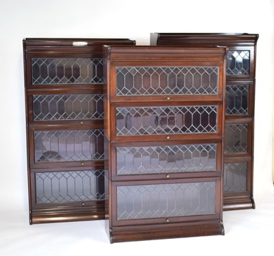 Lot 34 - A set of three Globe Wernicke style mahogany...