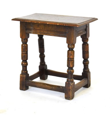 Lot 35 - An oak joint stool, the chamfered surface on...