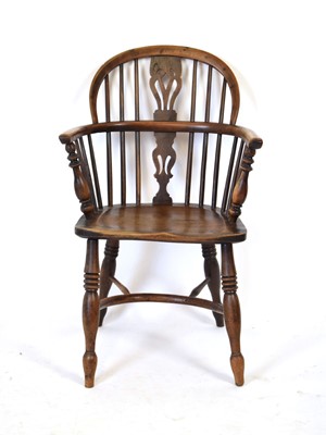 Lot 38 - A 19th century Windsor armchair with an elm...