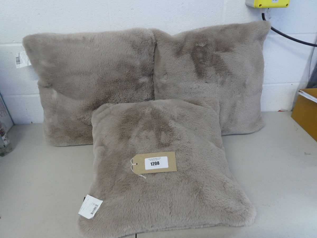 Lot A bag containing x3 Mon Chateau plush cushions...