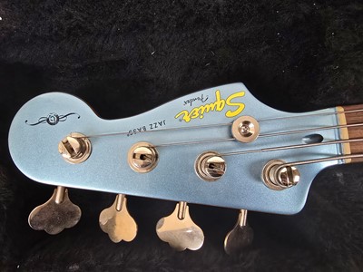 Lot A Chinese metallic blue Fender Squier jazz...