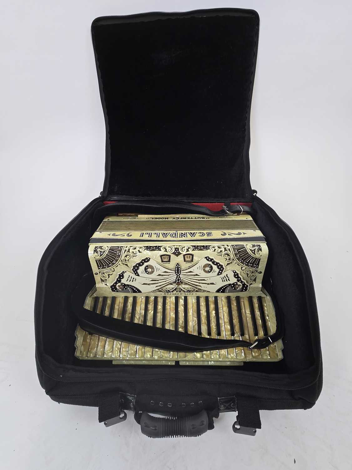 Lot A mother of pearl style cased Scandalli...