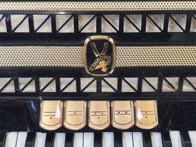 Lot A black leather cased Hohner Vitruola III...