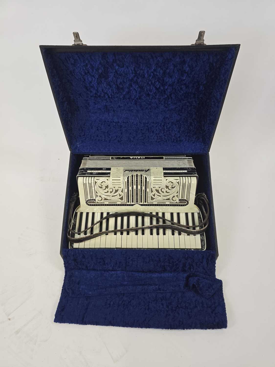 Lot A black leather cased Frontallini piano...