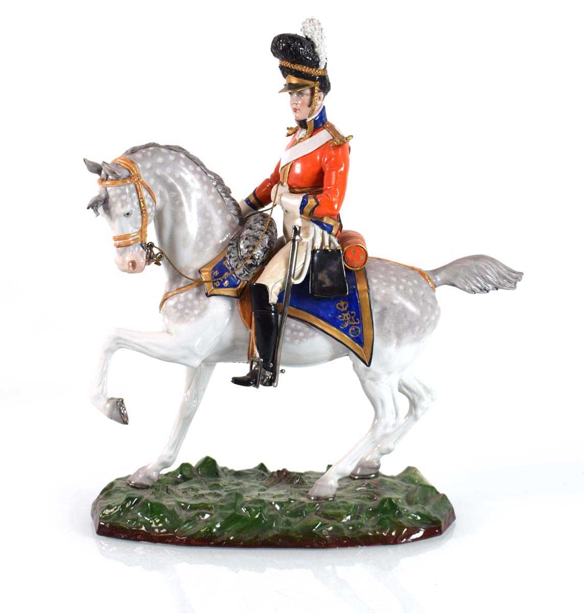 Lot 212 - A Sitzendorf military figure on horseback...