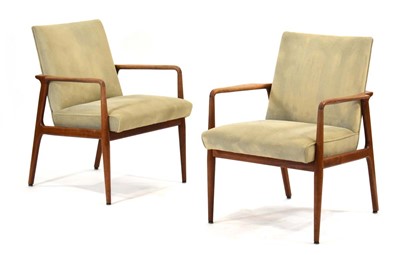 Lot 11 - A pair of American lounge armchairs with teak...