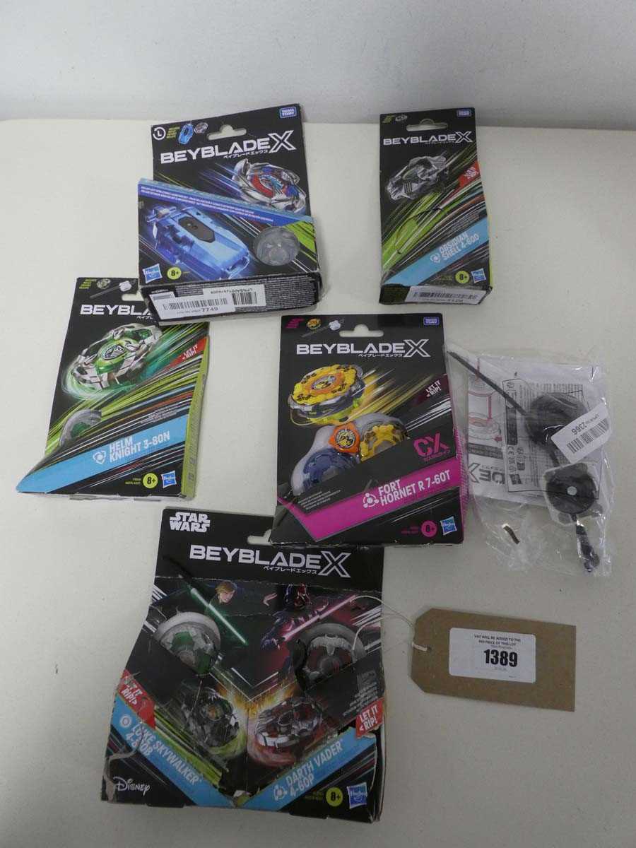 Lot 1389 - Small selection of Beyblades incl. Star Wars...