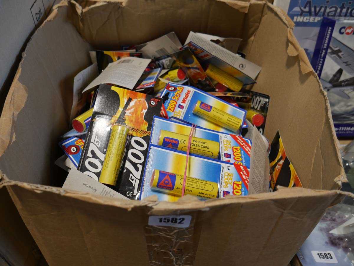 Lot 1582 - Box containing 007 cap gun caps in original...