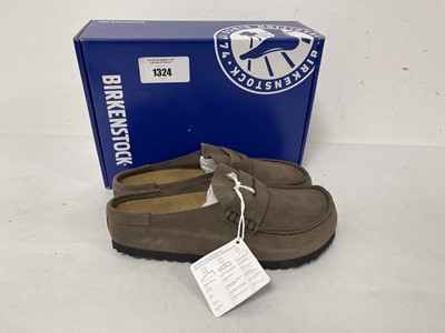 Lot Birkenstock naples wrapped shoes in concrete...