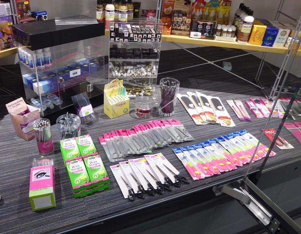 Lot 3356 - Hair accessories on the floor of the cabinet,...