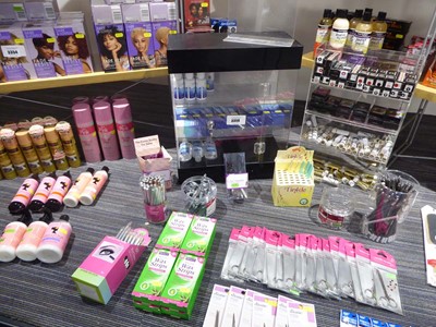 Lot 3356 - Hair accessories on the floor of the cabinet,...