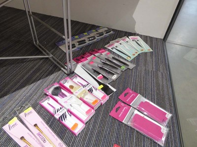 Lot 3356 - Hair accessories on the floor of the cabinet,...