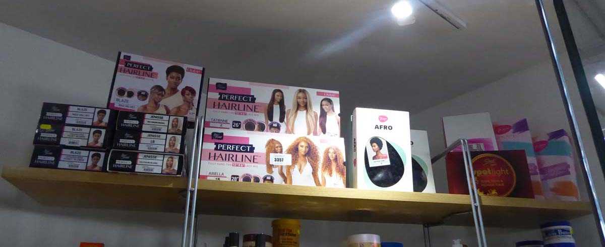 Lot 3357 - Shelf containing assortment of wigs including...