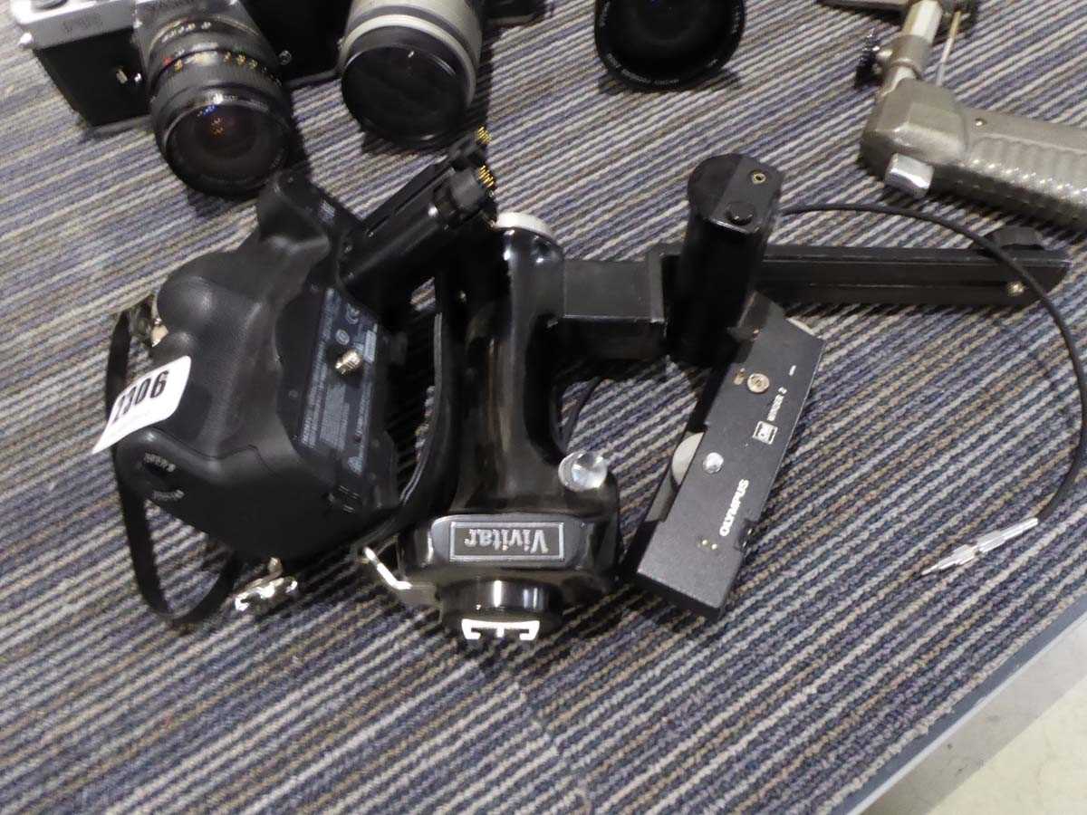 Lot 2306 - Sony vertical grip, Vivitar grip and a Olympus...