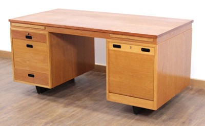 Lot 77 - A 1950/60's desk, the teak crossbanded surface...