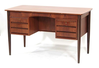 Lot 78 - A 1960's Danish teak desk, the cushioned...