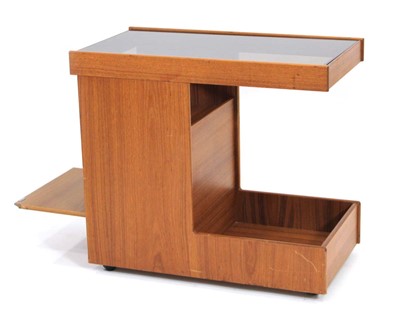 Lot 80 - A 1970/80's teak trolley or dry bar, the...