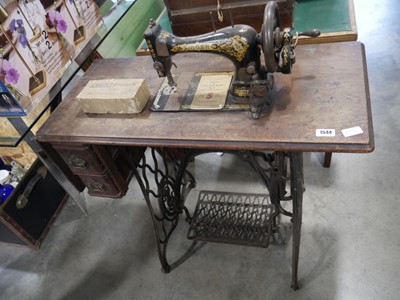 Lot 1544 - Singer sewing machine table with treadle base...