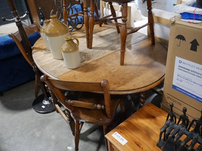 Lot 1554 - Dark oak barley twist drop leaf ovel dining...