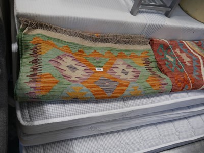 Lot 1576 - 313cm x 76cm hand made woven rug