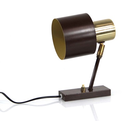 Lot 212 - A Danish brown enamelled and brass highlighted...