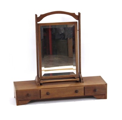 Lot 234 - A 1950's teak or walnut dressing table mirror,...