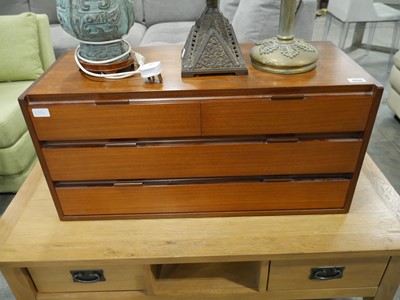 Lot 1036 - Mid century teak counter top chest of 2 over 2...