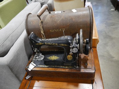 Lot 1043 - Dark oak cased Singer sewing machine