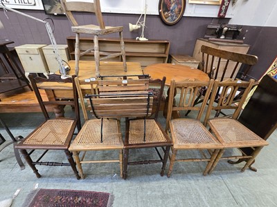 Lot 110 - A pair of stained wooden cane seated bar back...