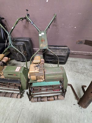 Lot 185 - A vintage green metal petrol lawnmower by Webb