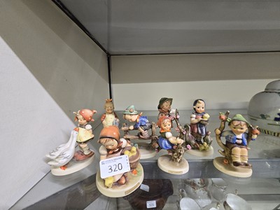 Lot 320 - A collection of eight Goebbel Hummel ceramic...