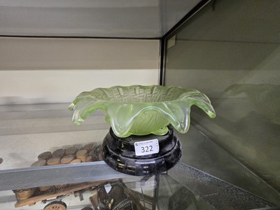 Lot 322 - A uranium glass centre piece bowl on a black...