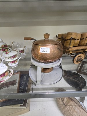 Lot 325 - A copper and cast metal fondue pan on stand...