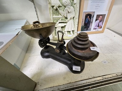 Lot 344 - A black painted cast metal set of balance...
