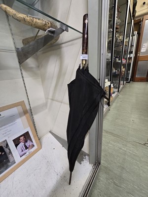 Lot 347 - A Victorian Bakelite handled umbrella by C A...