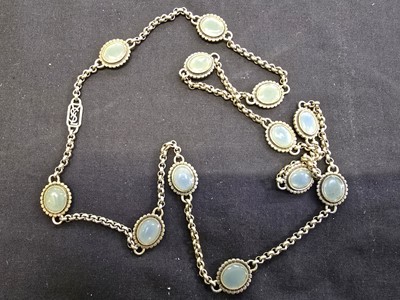 Lot 404 - A bag containing a white metal and green stone...