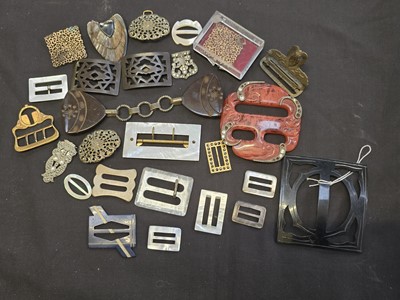 Lot 409 - A bag containing assorted buckles of various...