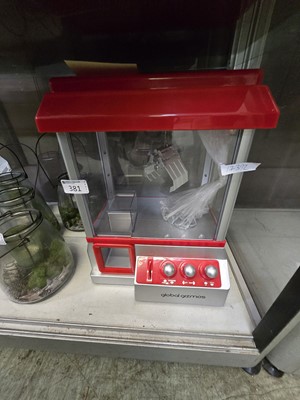 Lot 381 - Modern miniature claw arcade machine by Global...