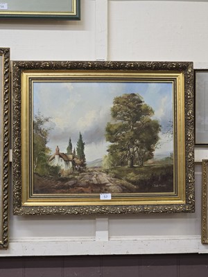 Lot 57 - An ornate gilt framed oil on canvas of cottage...