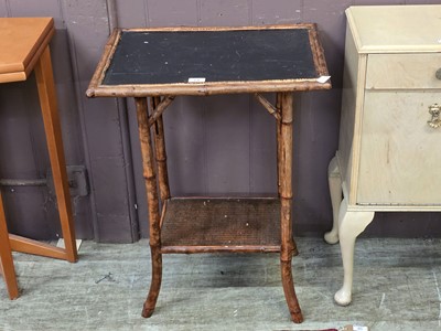 Lot 64 - A stained bamboo and wicker occasional table...
