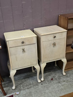Lot 66 - A pair of cream painted bedside cabinets by...