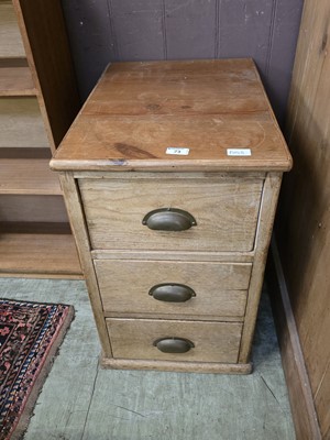 Lot 73 - A distressed pine three drawer filing cabinet