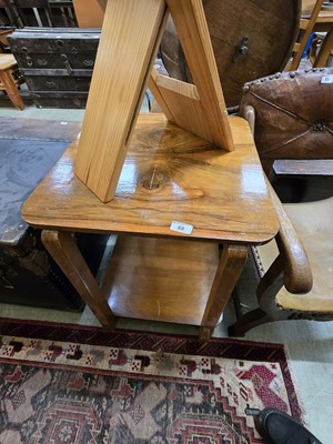Lot 88 - A two tier occasional table with book match...
