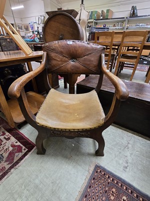 Lot 89 - An oak framed Savonarola style chair with...