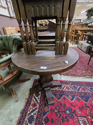 Lot 96 - A rustic stained wooden circular top...