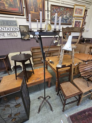 Lot 106 - An early 20th century wrought iron candle...