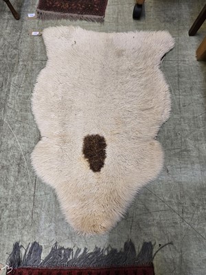 Lot 107 - A sheepskin rug