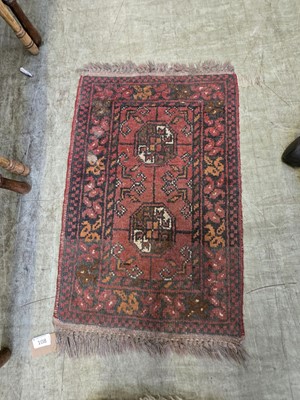 Lot 108 - An eastern red ground prayer mat with...